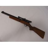 Sharp-Innova air rifle with wooden stock and metal telescopic sites