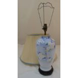 A porcelain baluster form table lamp decorated with flowers to include the shade, 40cm (h)