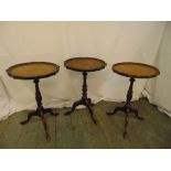 Three mahogany wine tables on three outswept legs and tooled leather inset tops, 51cm (h)