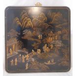 An early 20th century square lacquered chinoiserie wall panel decorated with figures in pavilions in