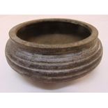 A Qing Dynasty bronze incense burner of ribbed circular form, 6cm (h)