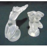 Lalique figurines of a dancing couple and a figurine of a naked lady on raised circular base,