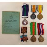 A quantity WWI and WWII medals with appropriate ribbons and a RAF log book, medals attributed to G-