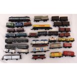 A quantity of OO gauge rolling stock to include petrol tankers, open trucks, cattle trucks and