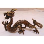 A Chinese bronze dragon supporting a crystal ball, 9cm (h)