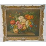 A framed oil on canvas still life of flowers indistinctly signed bottom left, 51 x61cm