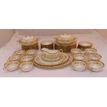 Aynsley Imperial Gold dinner service to include plates, soup bowls, vegetable dishes and oval meat