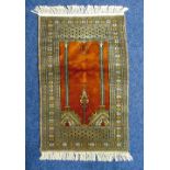 A Middle Eastern prayer rug, geometric form in greys, browns and gold, 94.5 x 62cm