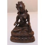 A Chinese gilded bronze figurine of a Buddha on raised oval plinth, 16cm (h)