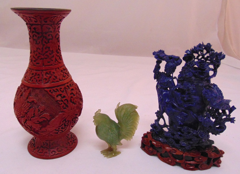 A quantity of Oriental collectables to include a cinnabar lacquer vase 23cm (h), a carved figurine