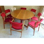 A teak mid 20th century oval dining table with eight chairs, A/F, table 72 x 182.5cm