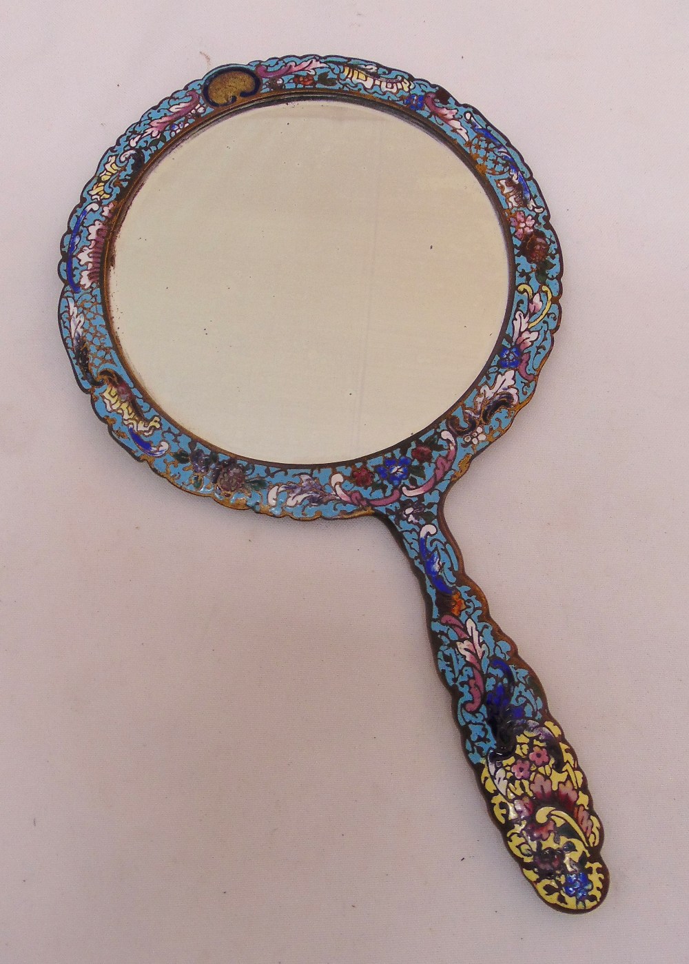 A Cloisonne and brass hand mirror, 19cm