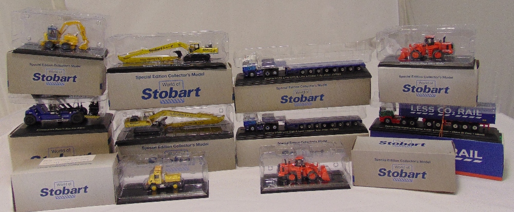 A quantity of World of Stobart diecast models to include transporters, excavators, low loaders and a