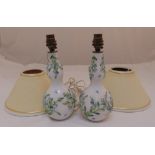 A pair of Augustus Rex porcelain table lamps of double gourd form with applied flowers and