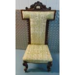 A Victorian mahogany upholstered prayer chair with barley twist column sides on four scroll legs