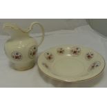 H J Wood Staffordshire jug and matching wash bowl decorated with roundels of floral sprays, jug 27cm