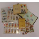 A quantity of ephemera to include stamps, cigarette cards and an Air Raid Precautions handbook