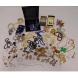 A quantity of costume jewellery to include brooches, rings, bracelets, necklaces and earrings