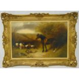 E Armfield framed oil on canvas of a horse and hunting dogs with the catch, signed bottom right,