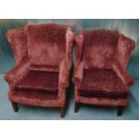 Two upholstered Mummy and Daddy wing back armchairs on four tapering rectangular legs