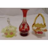 A quantity of decorative glassware to include two polychromatic glass baskets and a baluster vase on