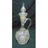 A 19th century etched glass decanter of baluster form with scroll handle with drop stopper,