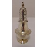 A George III silver hallmarked sugar sifter of baluster form with pierced pull off cover on raised