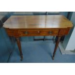 A late 19th century shaped rectangular mahogany desk, the single drawer with two brass swing