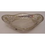 A hallmarked silver roll basket, shaped oval with scroll pierced sides, reeded borders on four