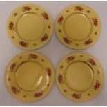 Four Clarice Cliff plates yellow ground with floral sprays, marks to the bases, 23cm (d)