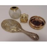 A quantity of hallmarked silver to include a hand mirror, a coaster, a salt cellar and a match