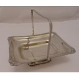 A hallmarked silver fruit basket rounded rectangular, gadroon and shell border with swing handle