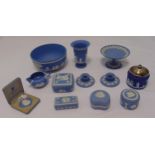 A quantity of Wedgwood blue Jasperware to include vases, bowls and covered boxes (12)