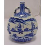 An early 20th century Chinese blue and white moon flask of customary form with dancing and musical