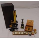 Two late 19th century brass microscopes one in fitted case and a quantity of specimens and