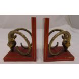A pair of brass and mahogany bookends in the form of antelope heads with horns, 19cm (h)