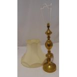 A brass table lamp of knopped baluster form on raised circular base and shade, 55cm (h)