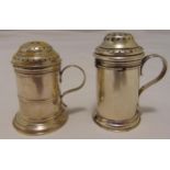 Two hallmarked silver kitchen pepperettes of cylindrical form with scroll handles and pierced
