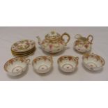 An early 20th century porcelain teaset to include a teapot, cups, saucers and a milk jug (11)