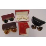 A pair of Cartier gilt frame sunglasses in original leather pouch, a pair of Must de Cartier reading