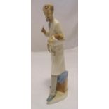 Lladro figurine of a vet holding a dog, marks to the base, 37cm (h)