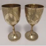 A Victorian hallmarked silver goblet engraved with flowers leaves and strap work on raised