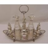 A Victorian hallmarked silver cruet set comprising a sugar sifter, a mustard pot with spoon, a