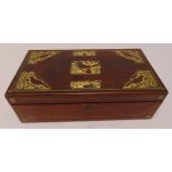 An early 20th century rectangular mahogany writing slope with brass inlays to the hinged cover, to