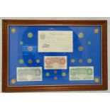 A framed and glazed GB collection of bank notes and coins to include a white five pound, 42 x 62.