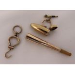 9ct gold telescopic cheroot holder and case with a 9ct gold boot hook, approx total weight 13.7g