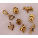 A quantity of 9ct gold jewellery to include six charms and two pendants, approx total weight 6.6g