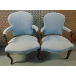 Two upholstered mahogany armchairs