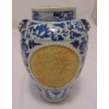 A Ming style blue and white baluster vase decorated with lotus leaves and ceramic panels with