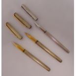 Three John Sterling by Colibri silver fountain pens two with 18ct gold nibs one with 14ct gold nib